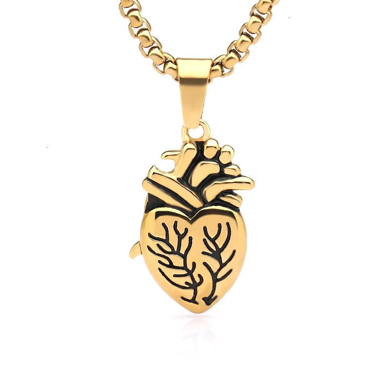 Gold necklace with a heart-shaped pendant on a white background