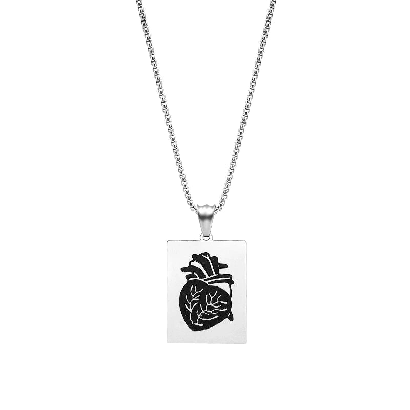 Necklace with a square pendant featuring an anatomical heart design on a white background