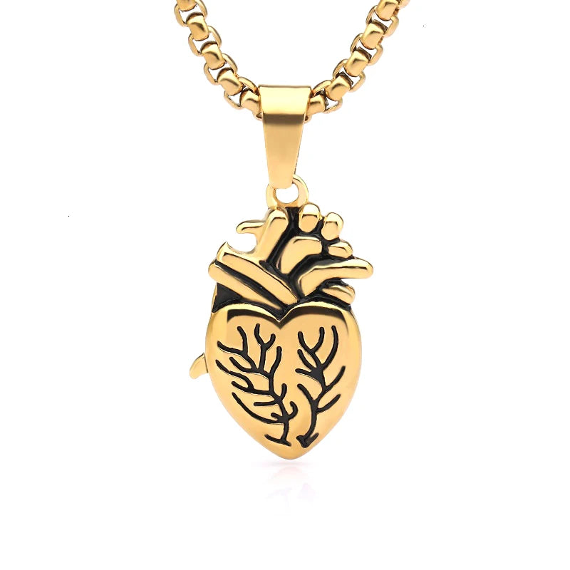Gold necklace with a heart-shaped pendant on a white background